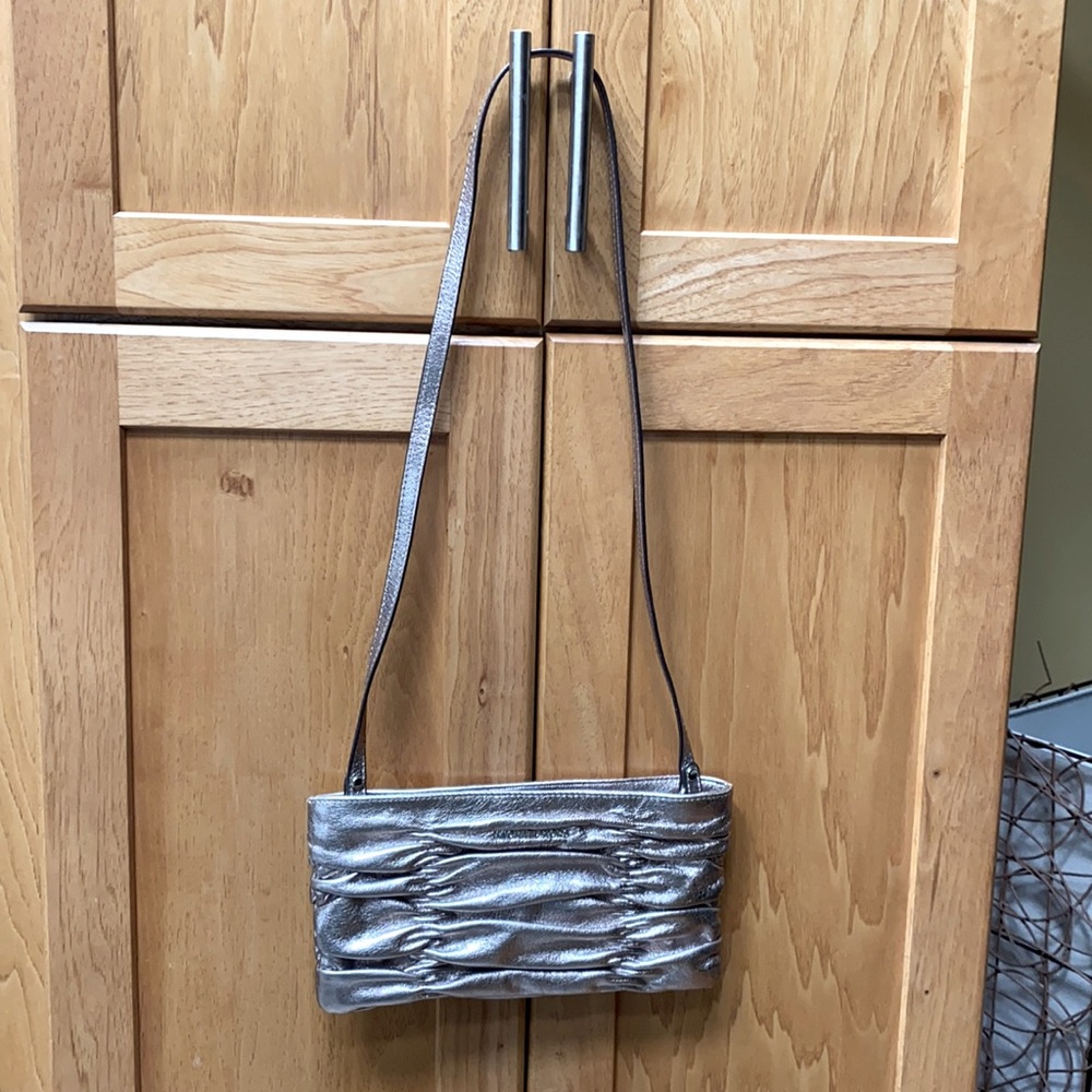 Metallic Michael Kors mini purse with strap